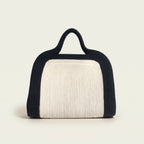 Elainor artisan cotton cord clutch bag with handle by Leila lifestyle view