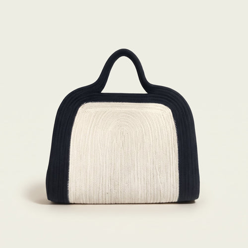 Elainor artisan cotton cord clutch bag with handle by Leila lifestyle view